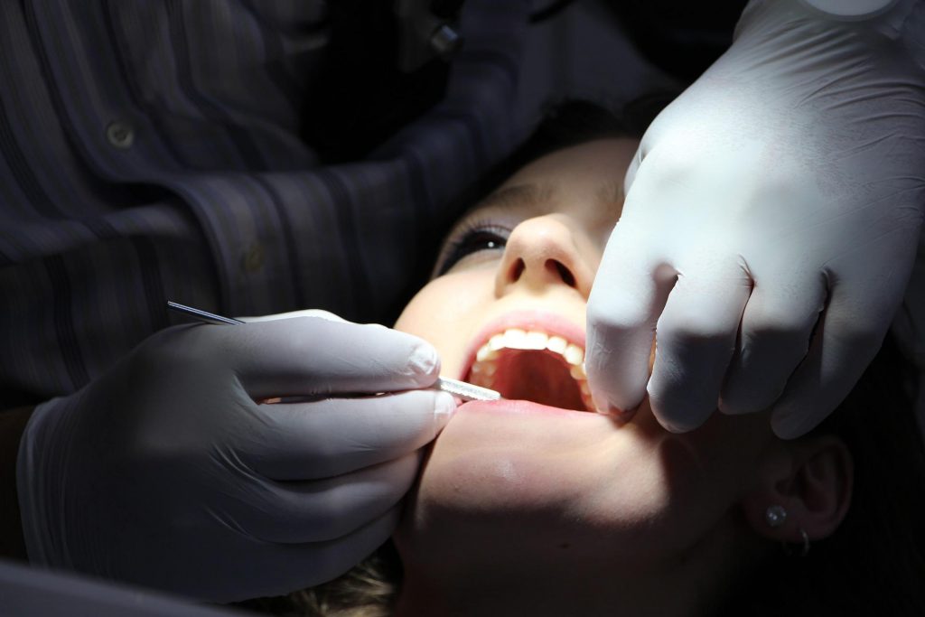 A dentist works on patient's fillings which contain dental amalgam